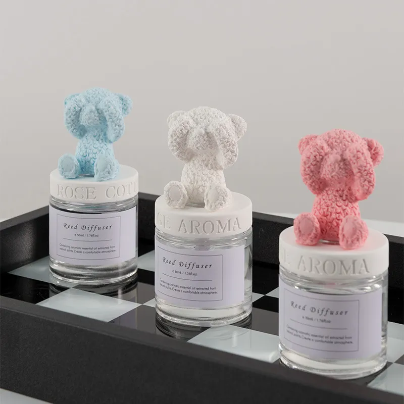 Venta al por mayor, nuevo diseño, ambientador de aire, difusor de caña de fibra perfumada, botella de vidrio, difusor de caña de oso de yeso encantador
